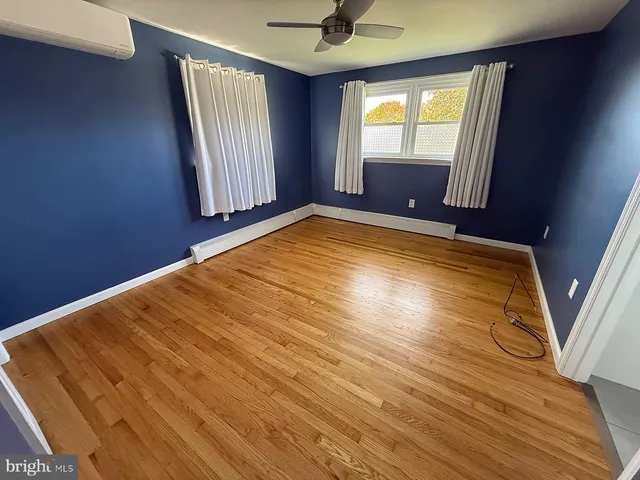 a view of an empty room with windows