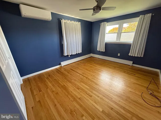 a bathroom with a granite countertop sink mirror and shower