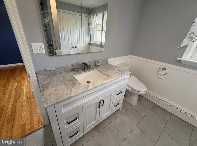 a view of a bathroom with a glass door shower