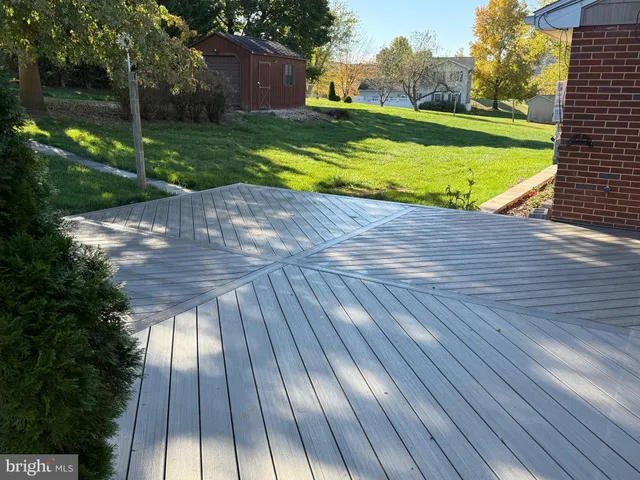 a view of a yard with wooden floor