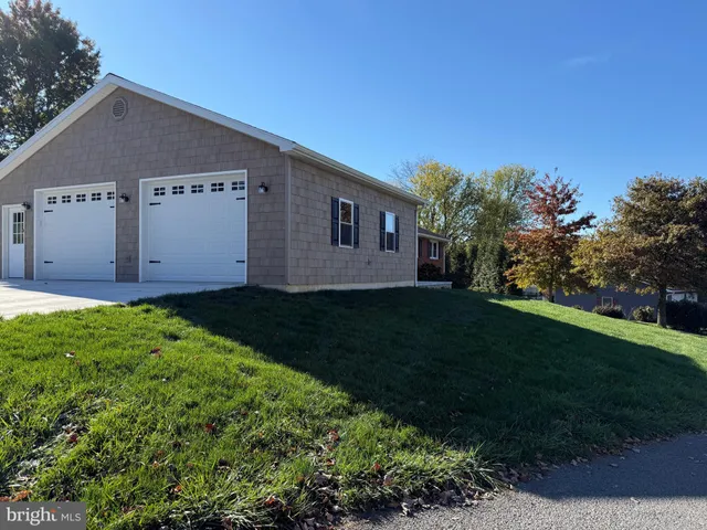 a view of a house with garden and yard