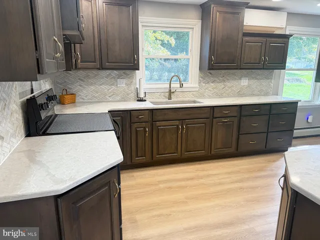 a kitchen with a sink and a window
