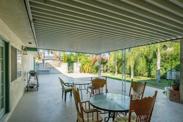 a view of a dining room with furniture and window