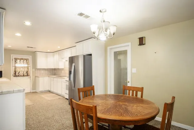 a view of a dining room with furniture