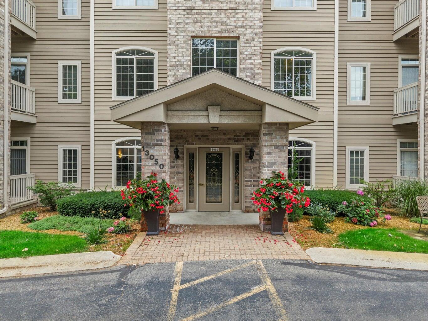 13050 West Bluemound Road, Unit 307 Elm Grove, WI 53122 - Photo 23 of 29 A Stately and Welcoming Entrance