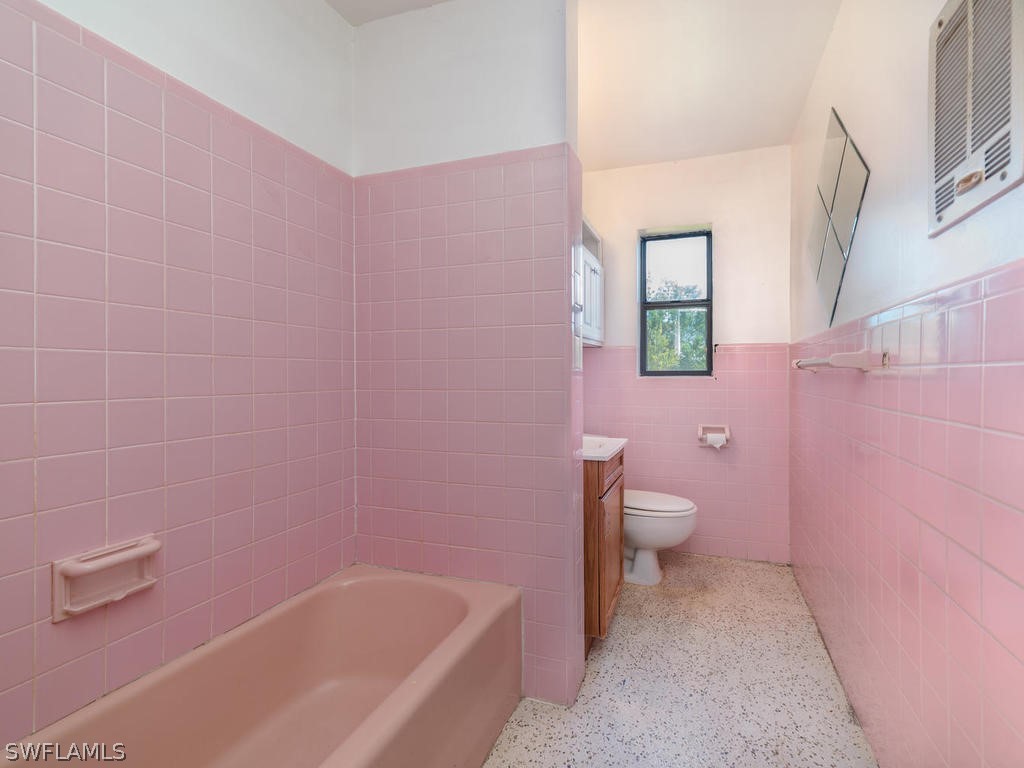 2118 Pineview Road Fort Myers, FL 33901 - Photo 9 of 17 a bathroom with a bathtub sink and toilet