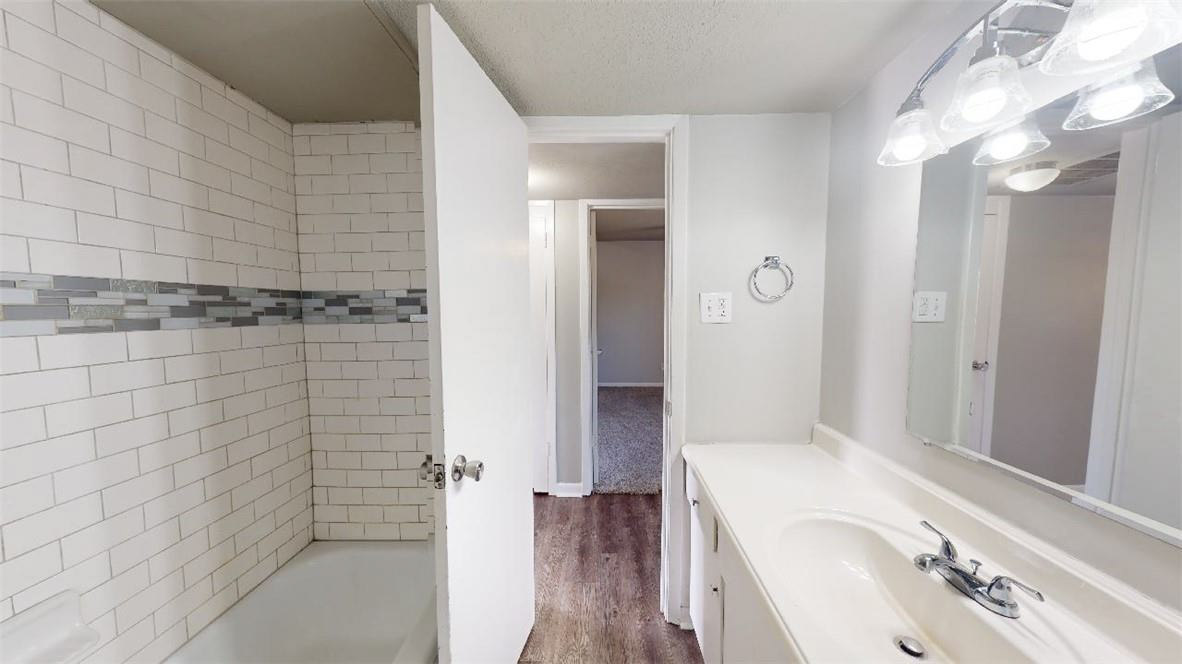3800 East 29th Street, Unit 5 Bryan, TX 77802 - Photo 20 of 35 a bathroom with a bathtub and shower