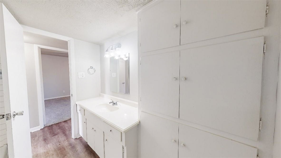 3800 East 29th Street, Unit 5 Bryan, TX 77802 - Photo 27 of 35 a bathroom with a sink a mirror and a shower
