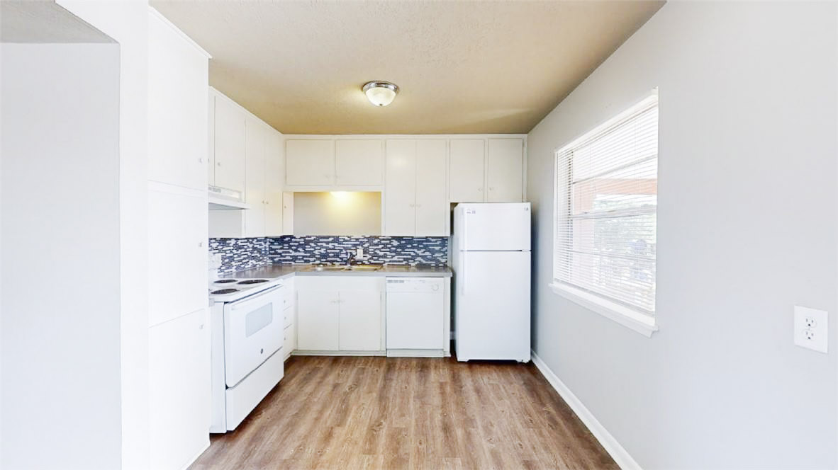 3800 East 29th Street, Unit 5 Bryan, TX 77802 - Photo 31 of 35 a bathroom with a granite countertop sink and a mirror
