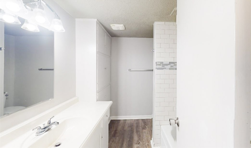 3800 East 29th Street, Unit 5 Bryan, TX 77802 - Photo 33 of 35 a bathroom with a tub sink and vanity