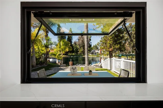 a kitchen with a table chairs stove and cabinets