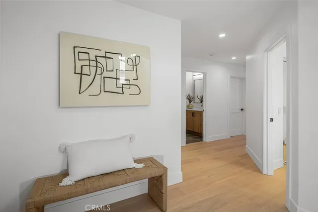 a view of entryway with wooden floor and stairs