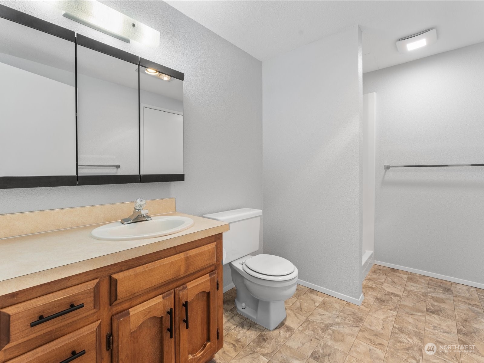 3119 Mountain View Road Ferndale, WA 98248 - Photo 24 of 40 a bathroom with a sink a toilet and a mirror
