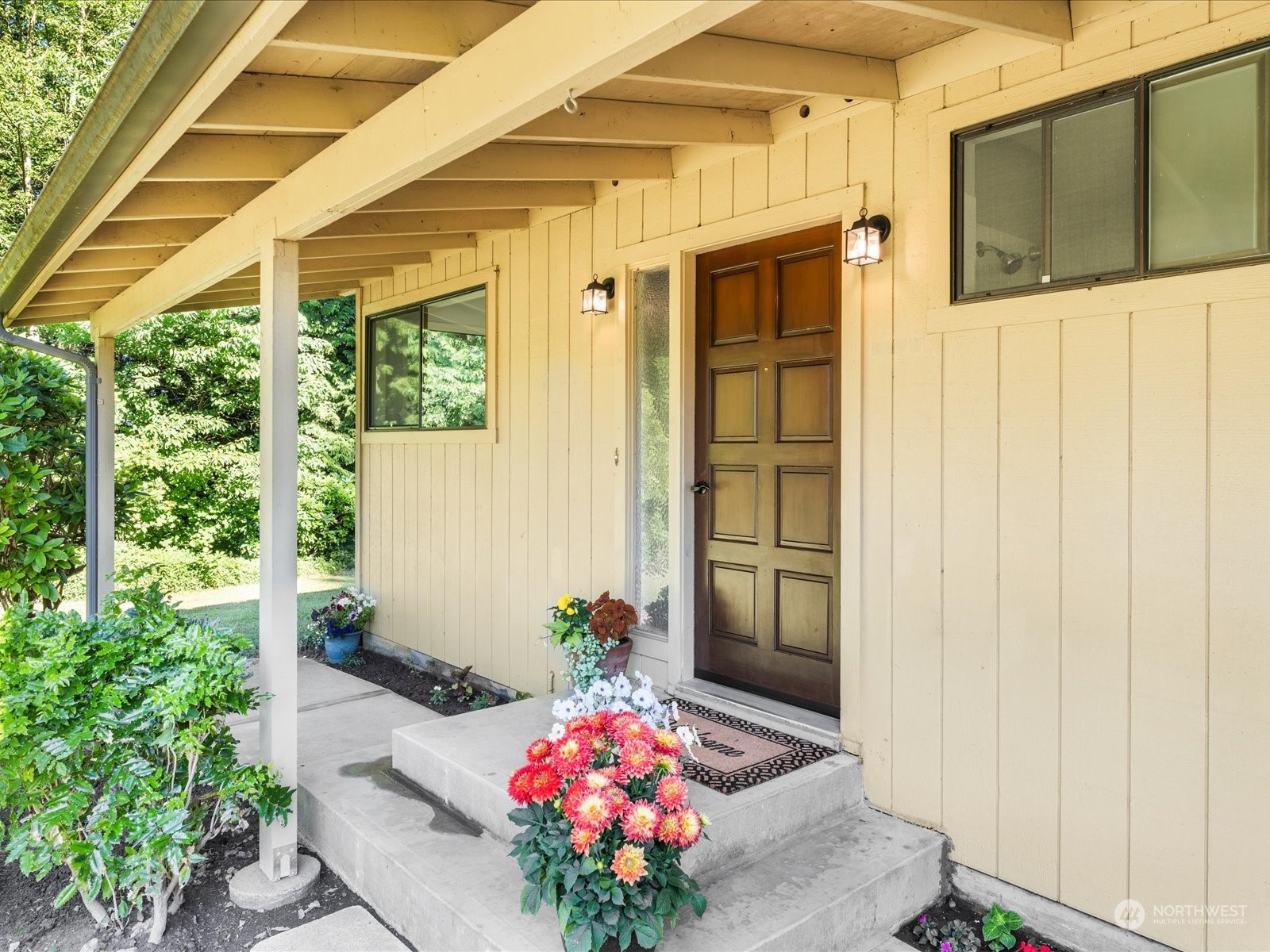 3119 Mountain View Road Ferndale, WA 98248 - Photo 3 of 40 a front view of a house with a potted plant