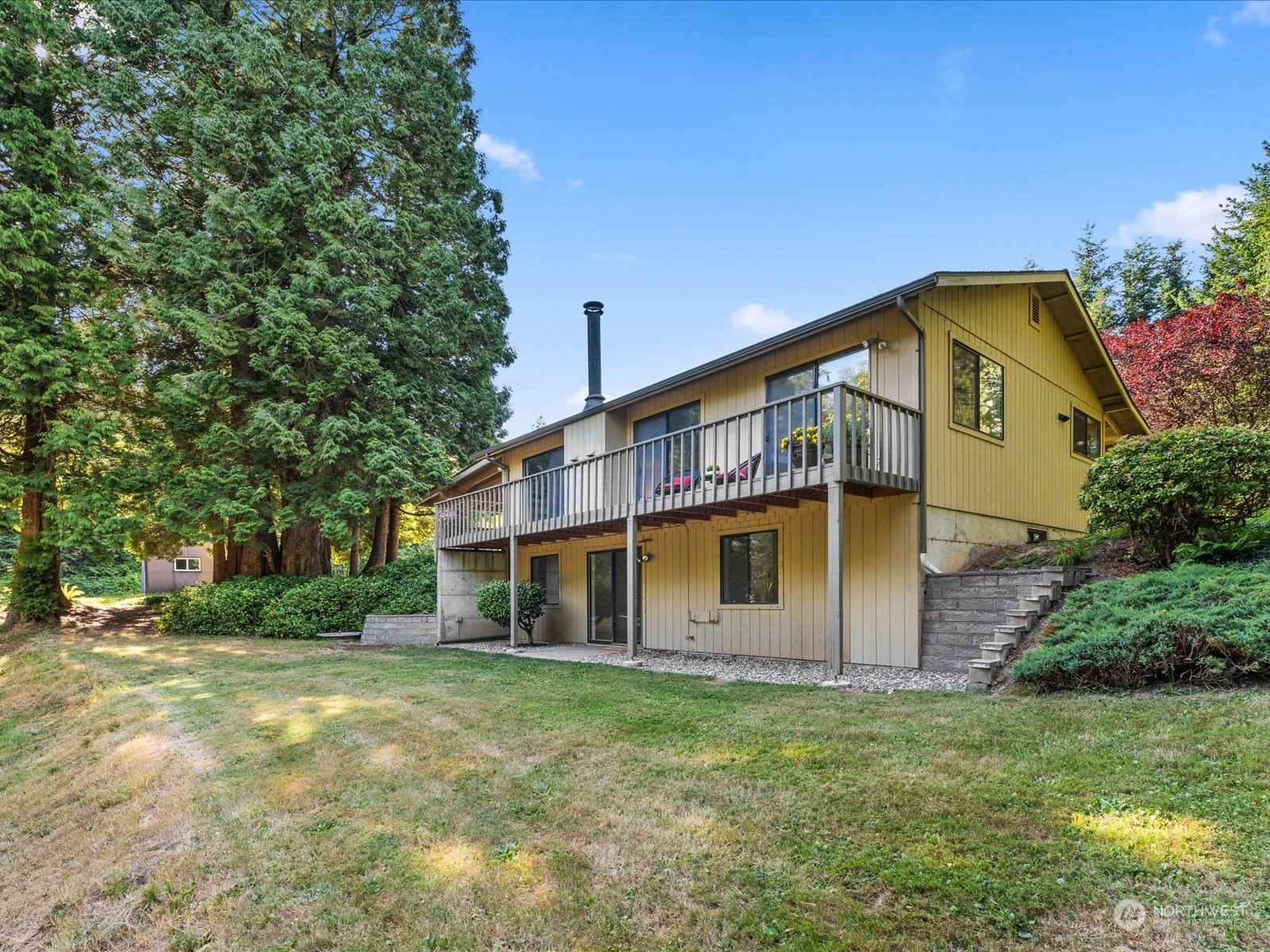 3119 Mountain View Road Ferndale, WA 98248 - Photo 32 of 40 a view of a house with a yard and plants