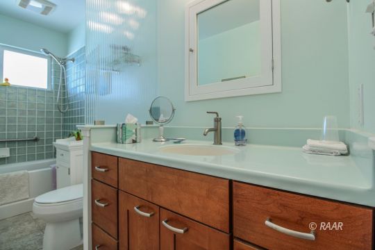 637 Randall Street Ridgecrest, CA 93555 - Photo 25 of 32 a bathroom with a toilet sink and mirror