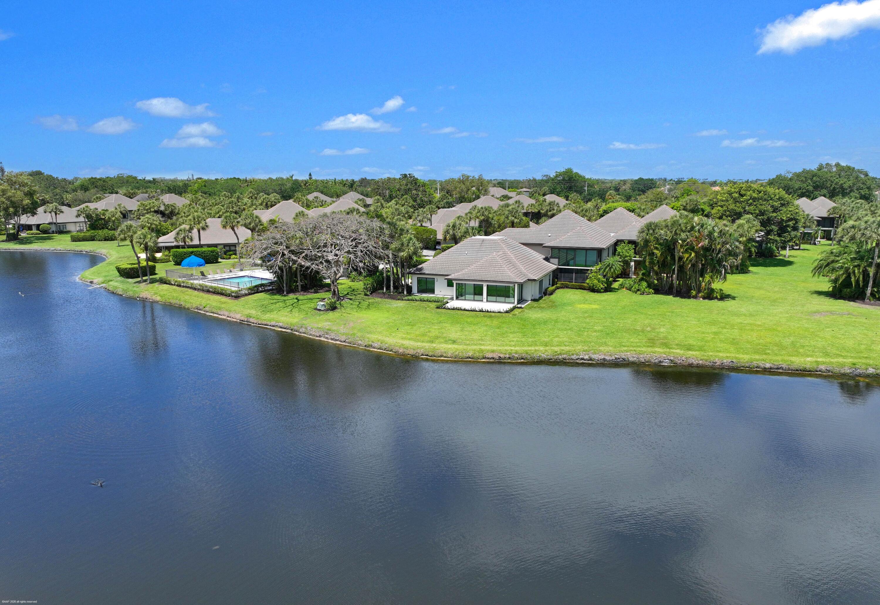 13254 Polo Club Road, Unit C101 Wellington, FL 33414 - Photo 2 of 71 an aerial view of a house with a yard and lake view