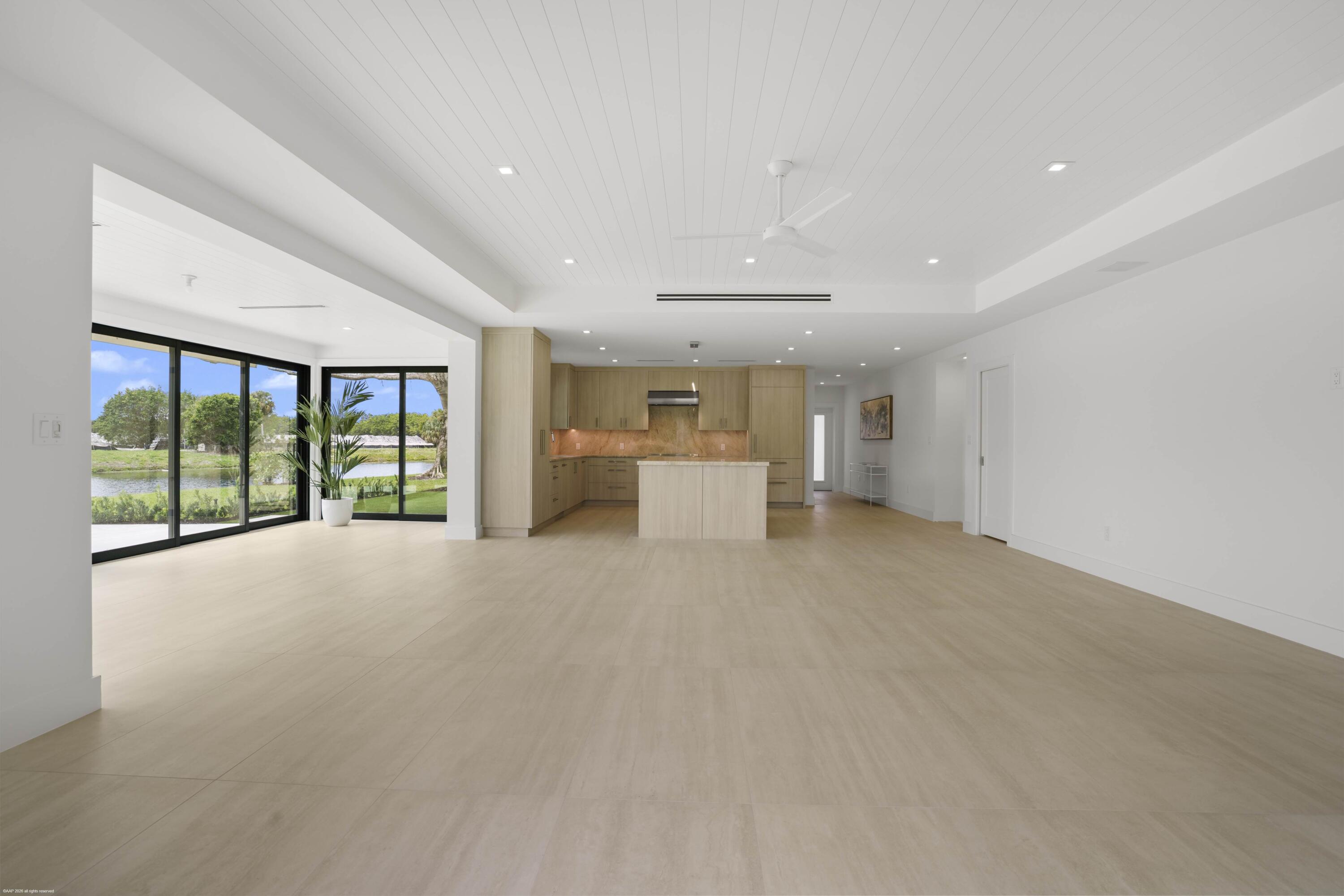 13254 Polo Club Road, Unit C101 Wellington, FL 33414 - Photo 23 of 71 a view of a livingroom with furniture and floor to ceiling window
