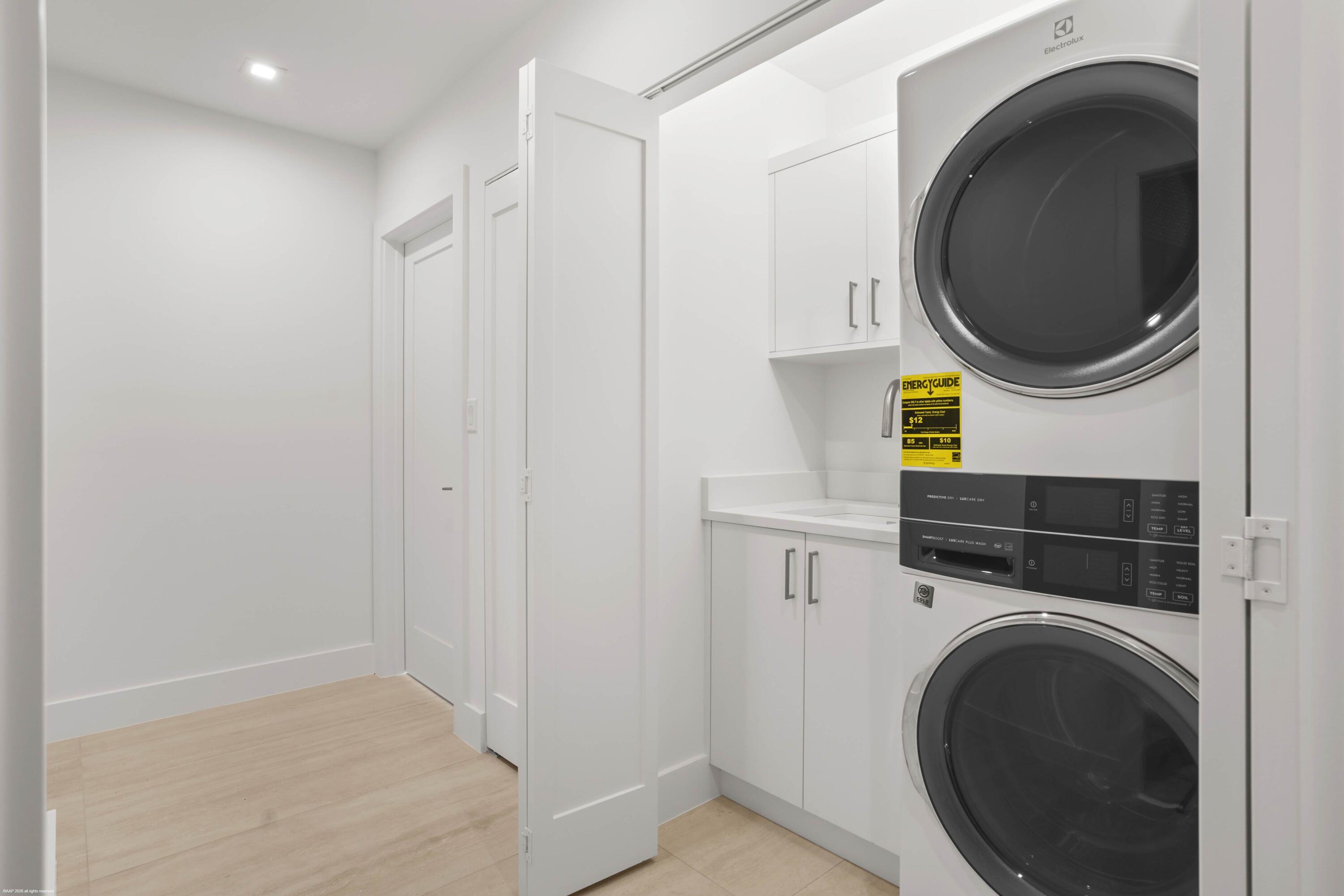 13254 Polo Club Road, Unit C101 Wellington, FL 33414 - Photo 30 of 71 a utility room with dryer and washer