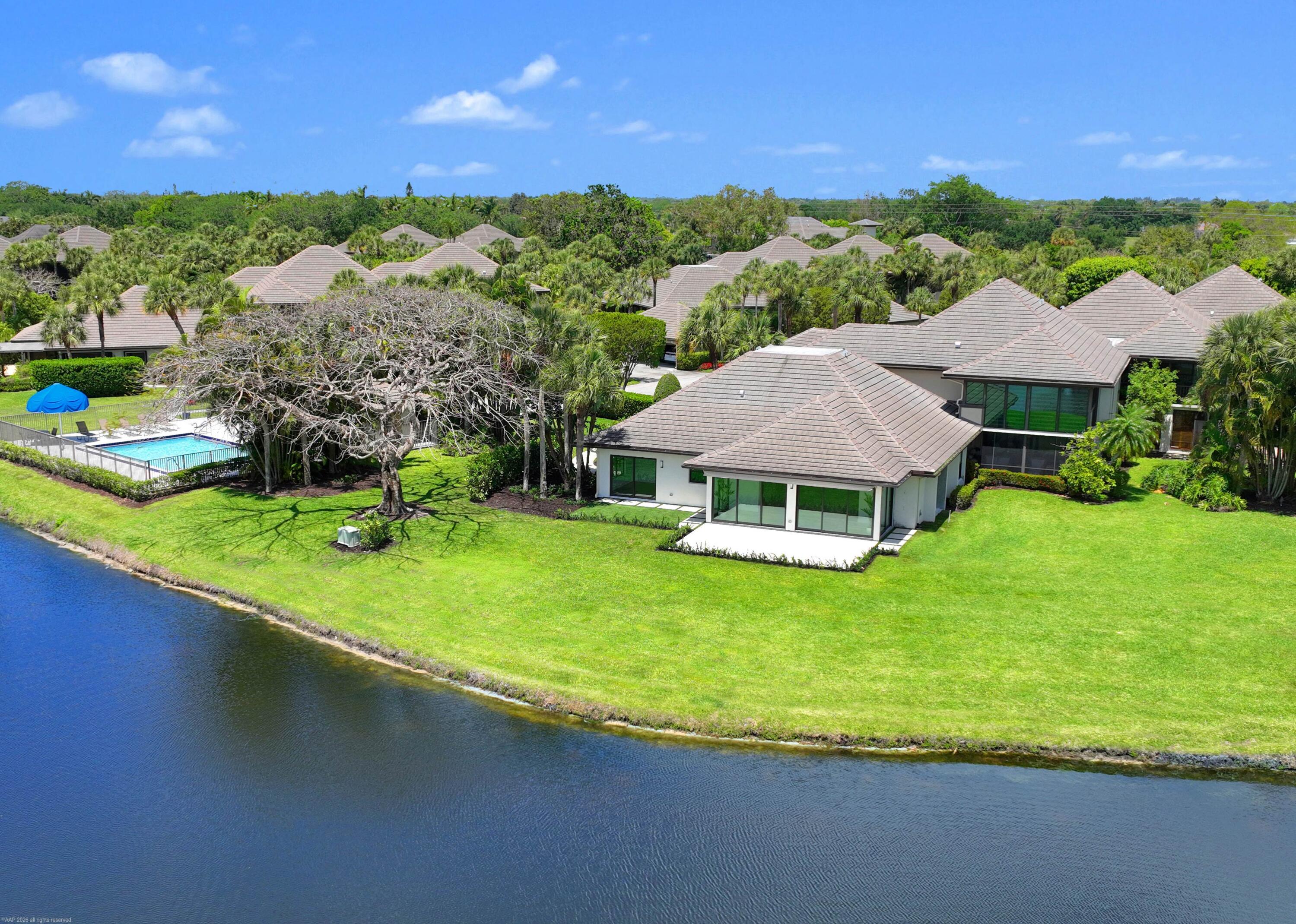 13254 Polo Club Road, Unit C101 Wellington, FL 33414 - Photo 3 of 71 a view of a house with a big yard