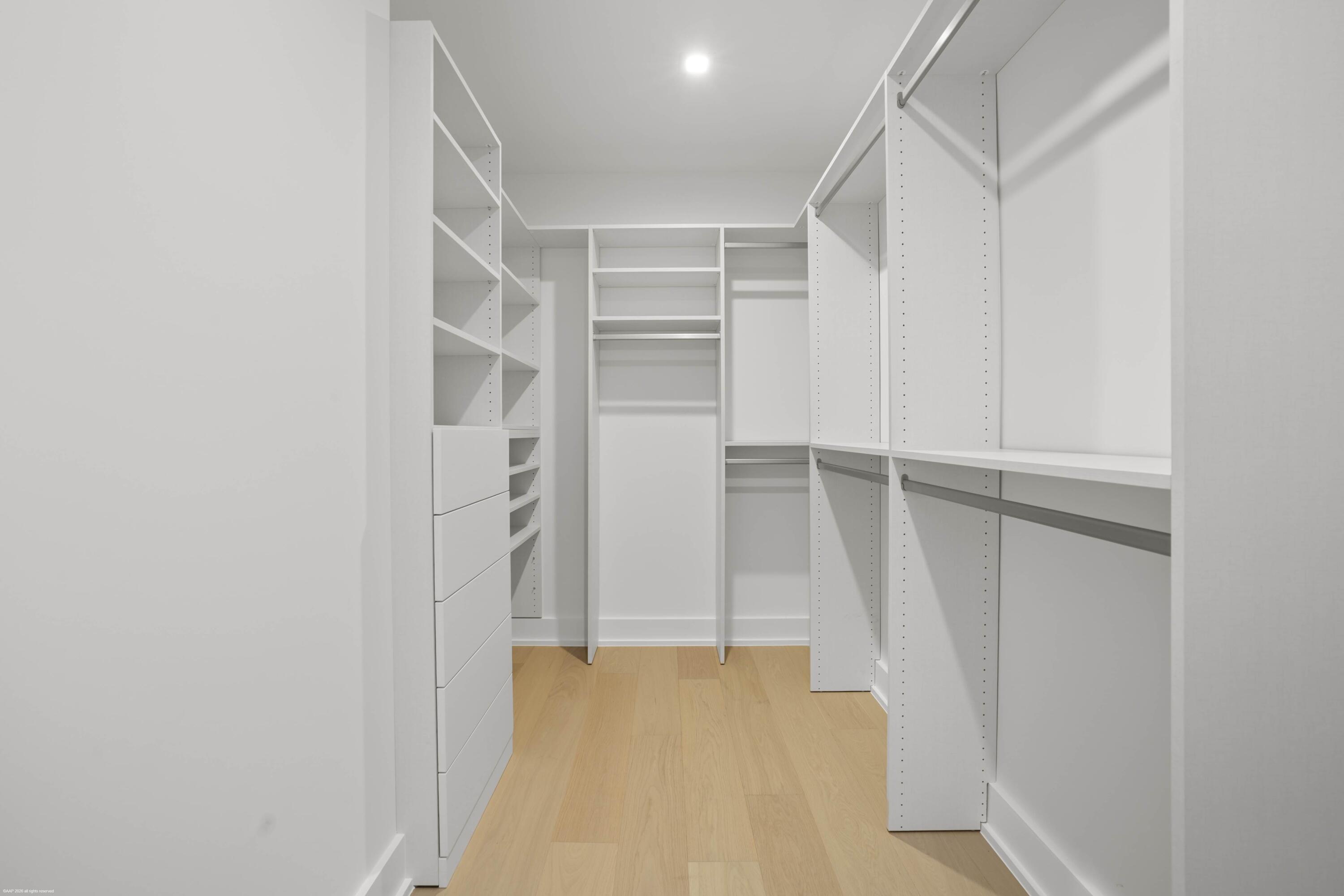 13254 Polo Club Road, Unit C101 Wellington, FL 33414 - Photo 35 of 71 a view of walk in closet with empty racks