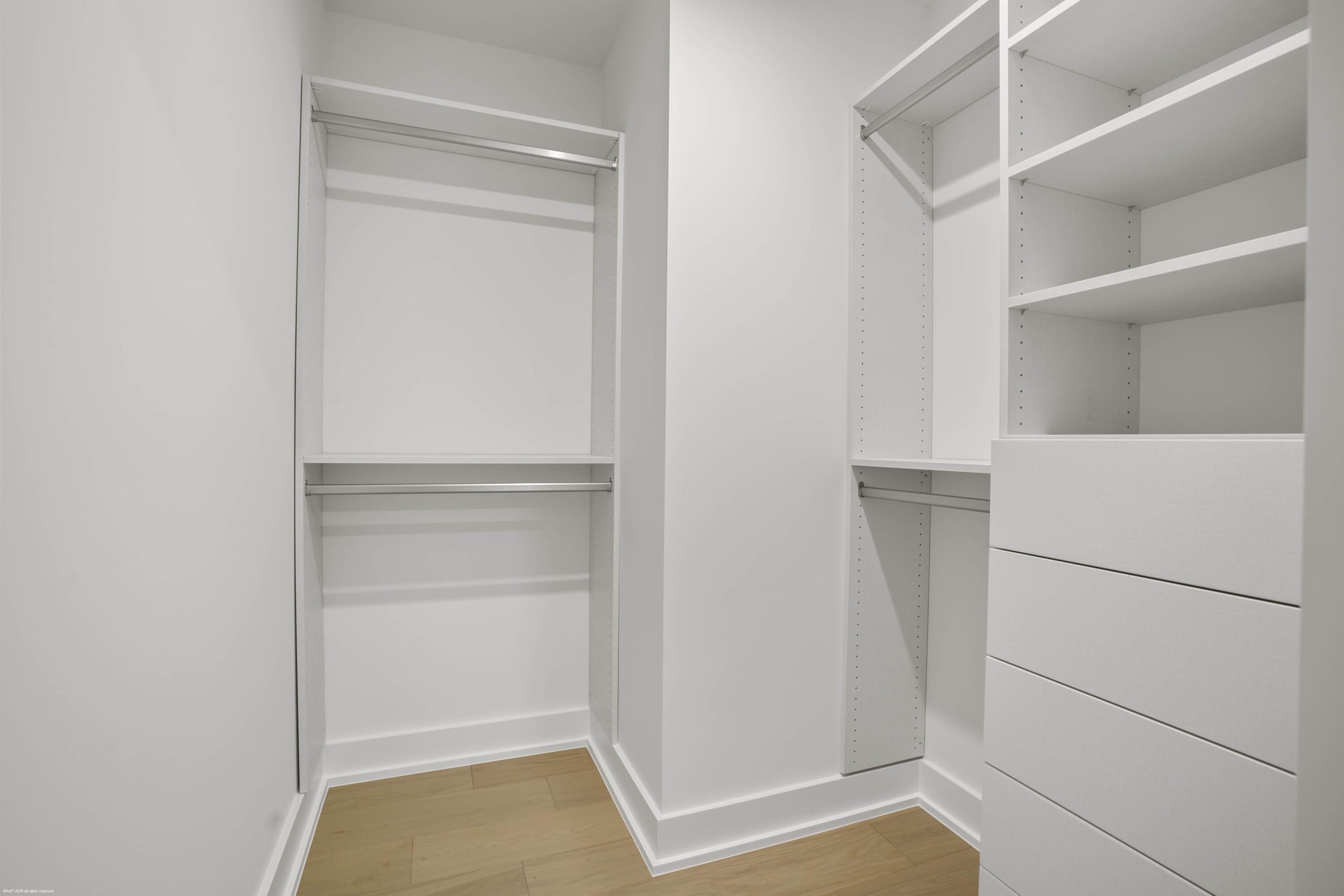 13254 Polo Club Road, Unit C101 Wellington, FL 33414 - Photo 36 of 71 a view of walk in closet with empty racks