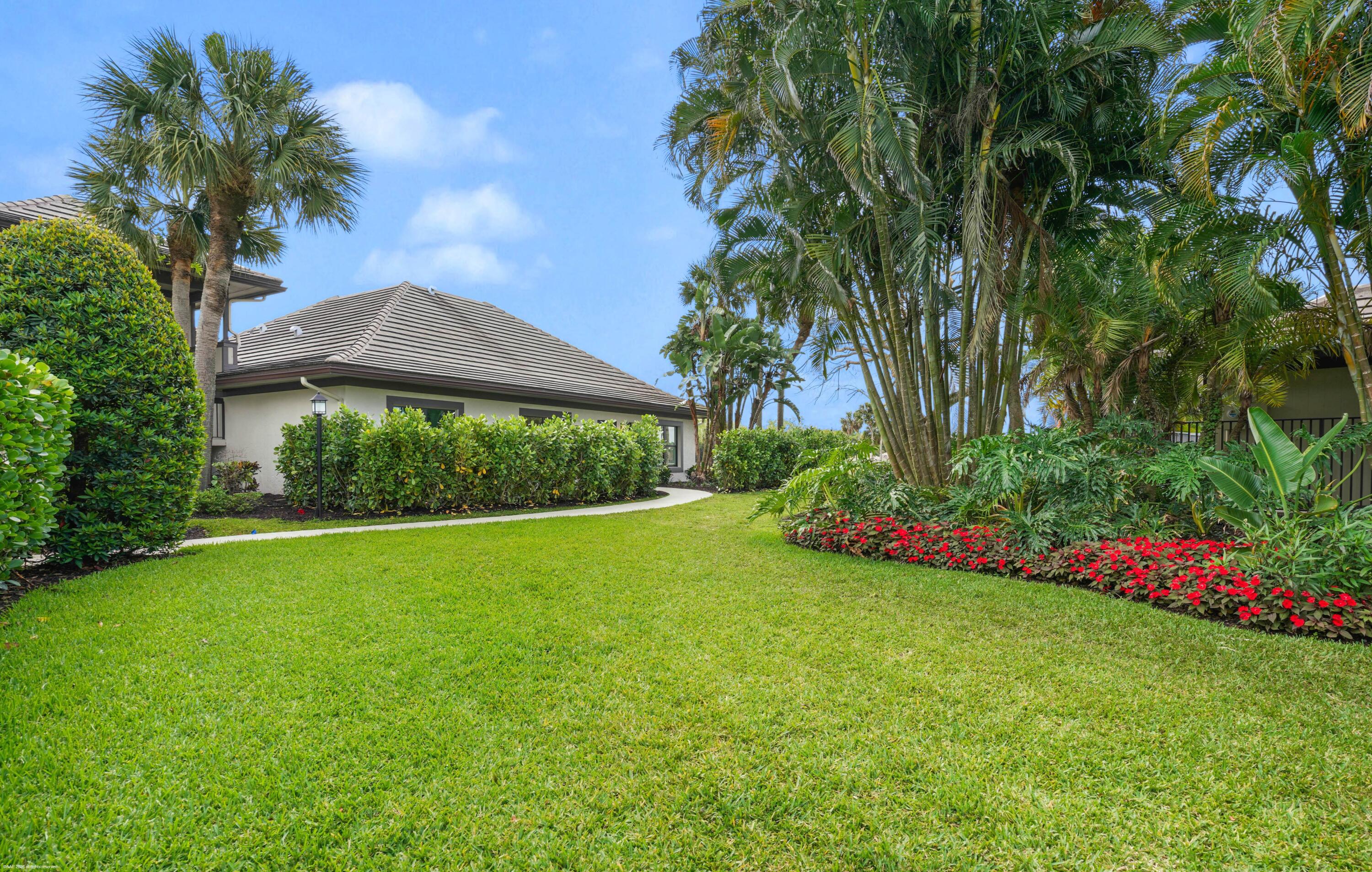 13254 Polo Club Road, Unit C101 Wellington, FL 33414 - Photo 4 of 71 a view of a garden with a small yard