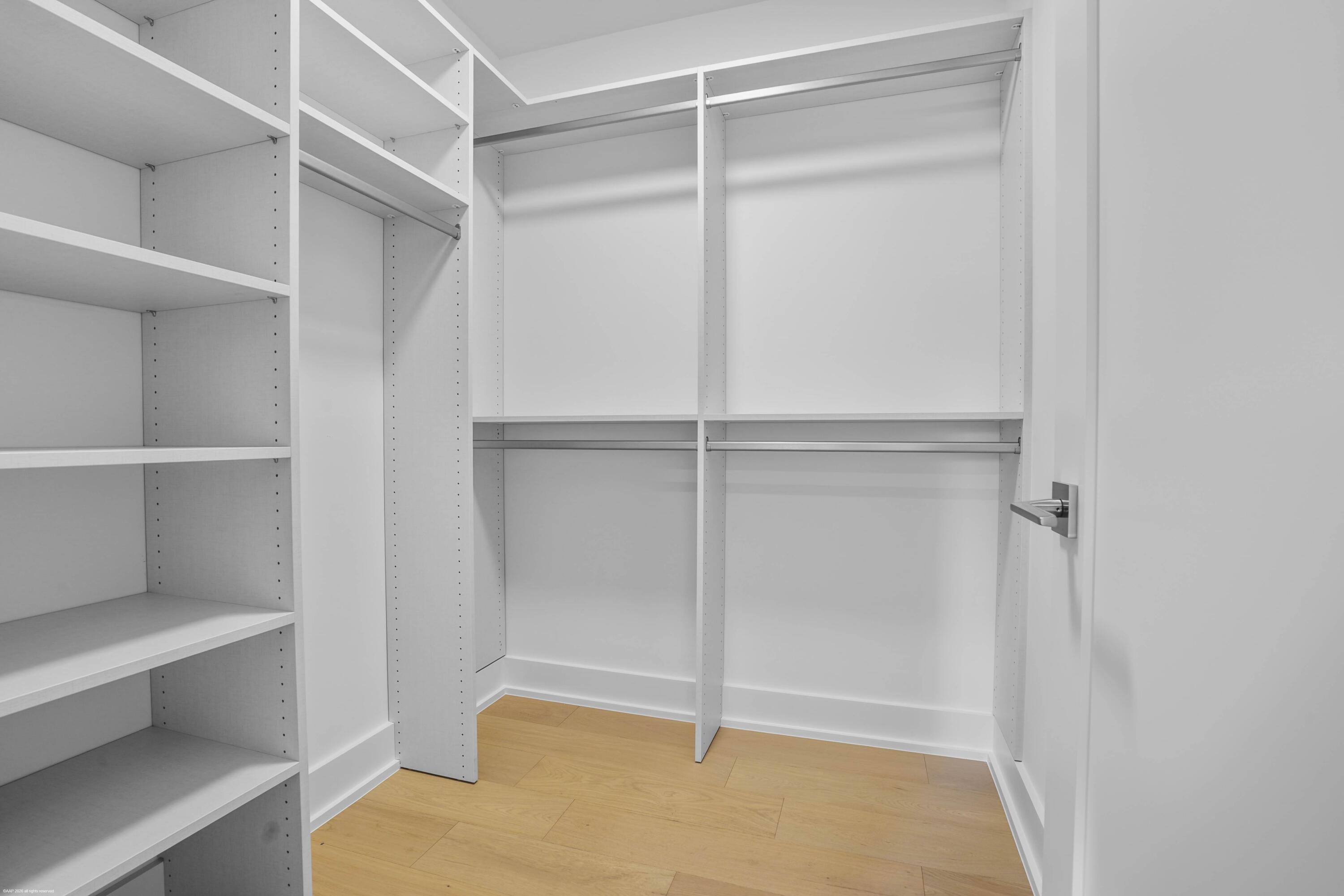13254 Polo Club Road, Unit C101 Wellington, FL 33414 - Photo 43 of 71 a view of an empty walk in closet