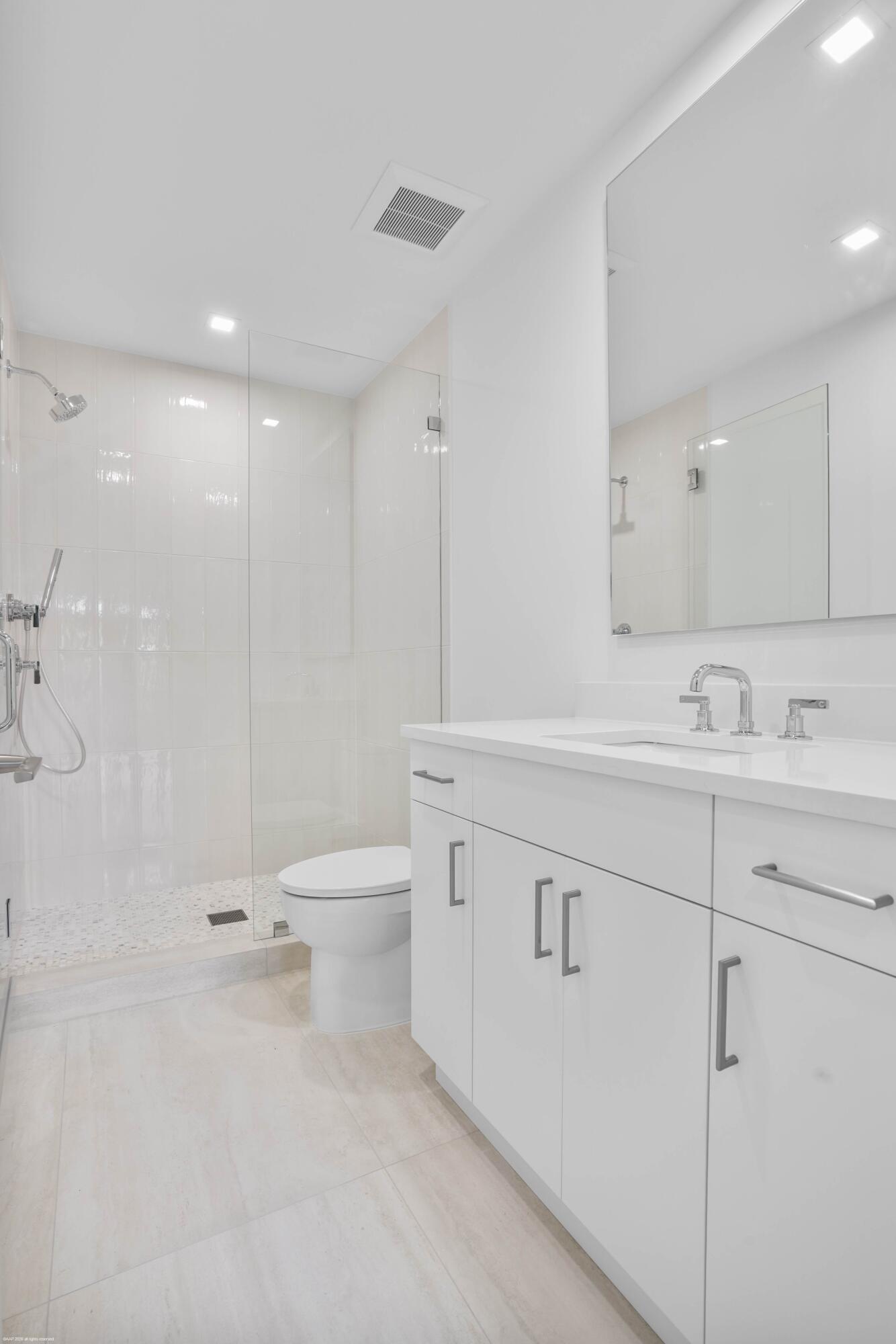 13254 Polo Club Road, Unit C101 Wellington, FL 33414 - Photo 47 of 71 a bathroom with a sink a toilet and a shower