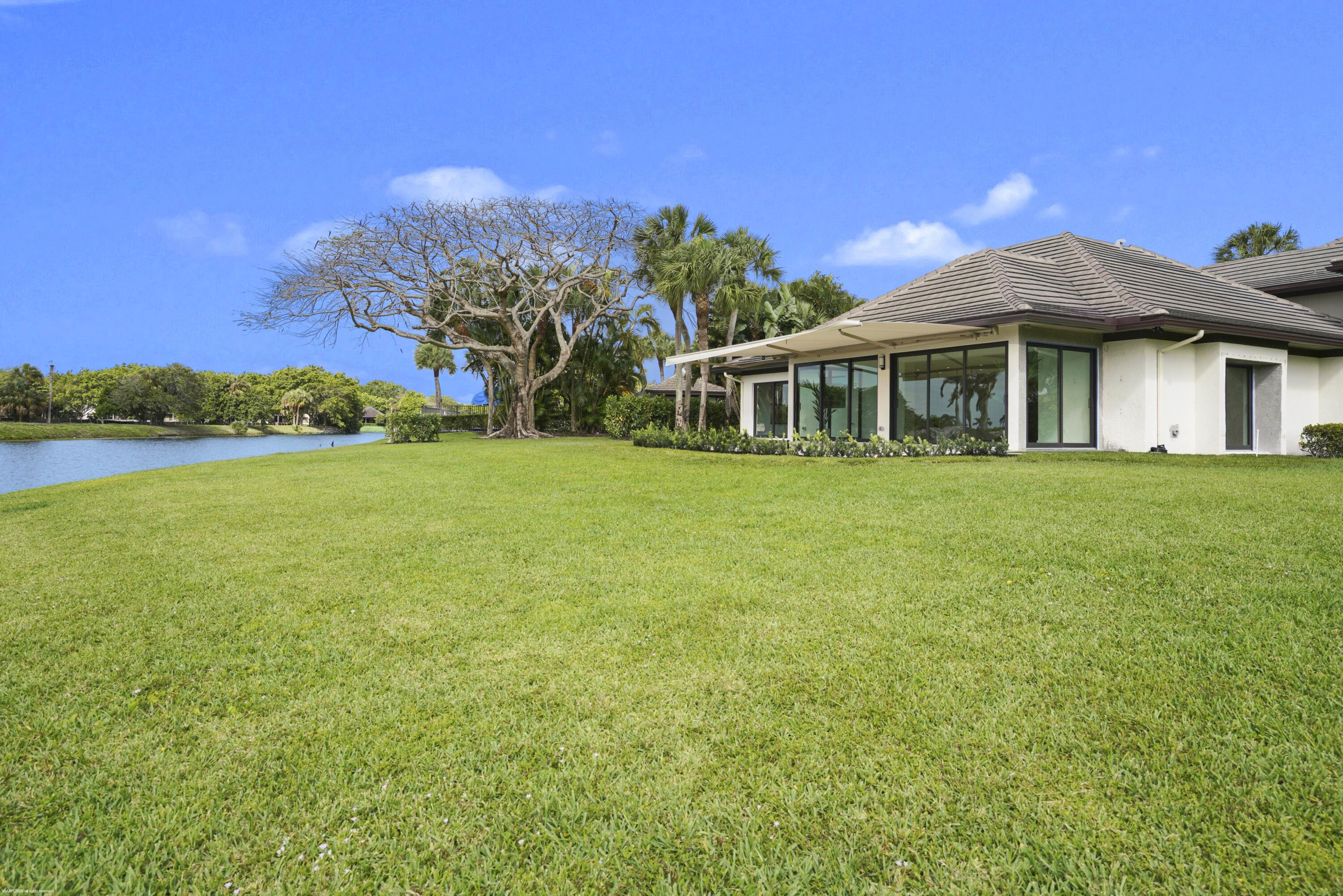 13254 Polo Club Road, Unit C101 Wellington, FL 33414 - Photo 53 of 71 a view of a house with a big yard
