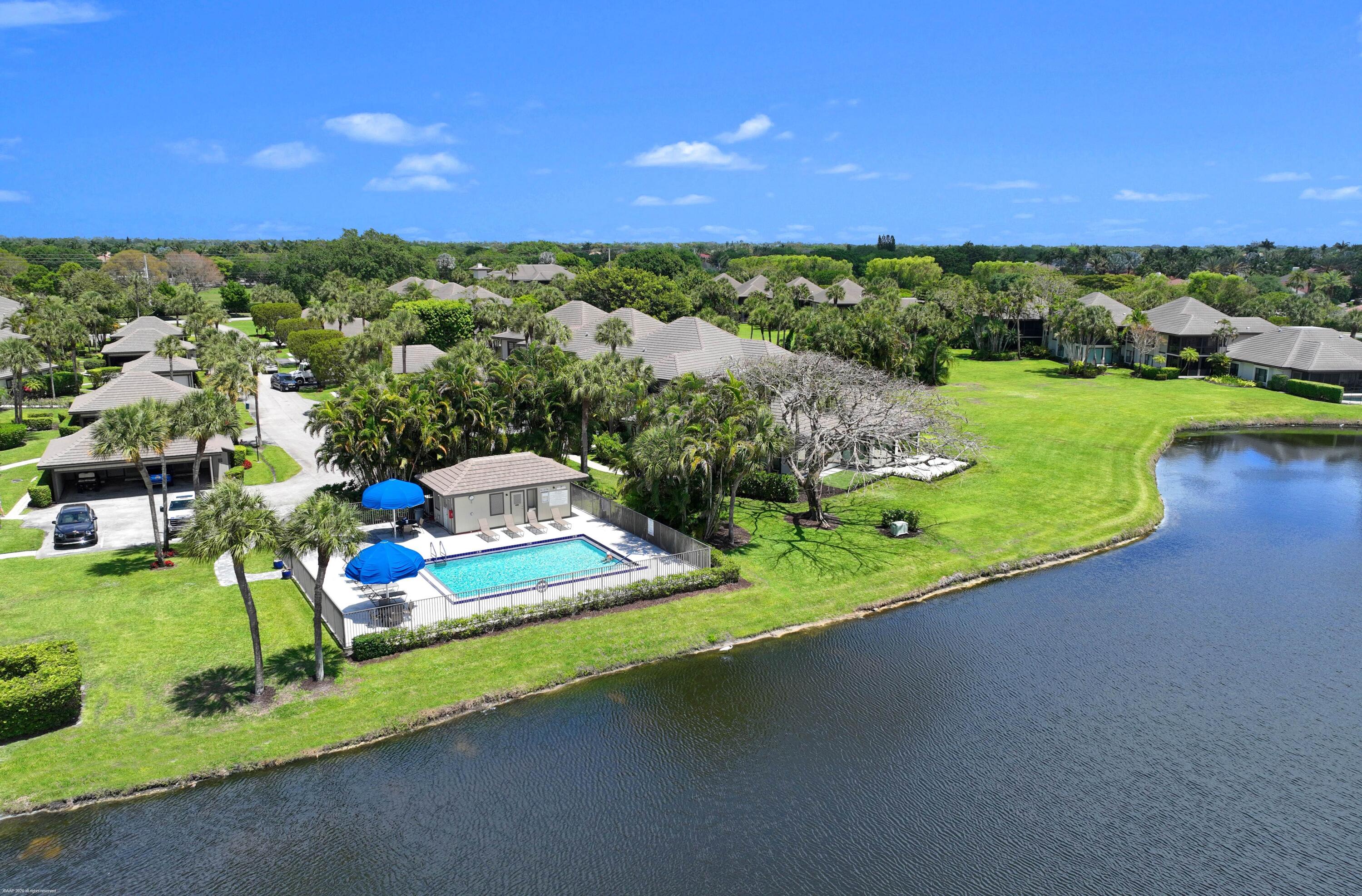 13254 Polo Club Road, Unit C101 Wellington, FL 33414 - Photo 56 of 71 a view of a house with a yard and lake view