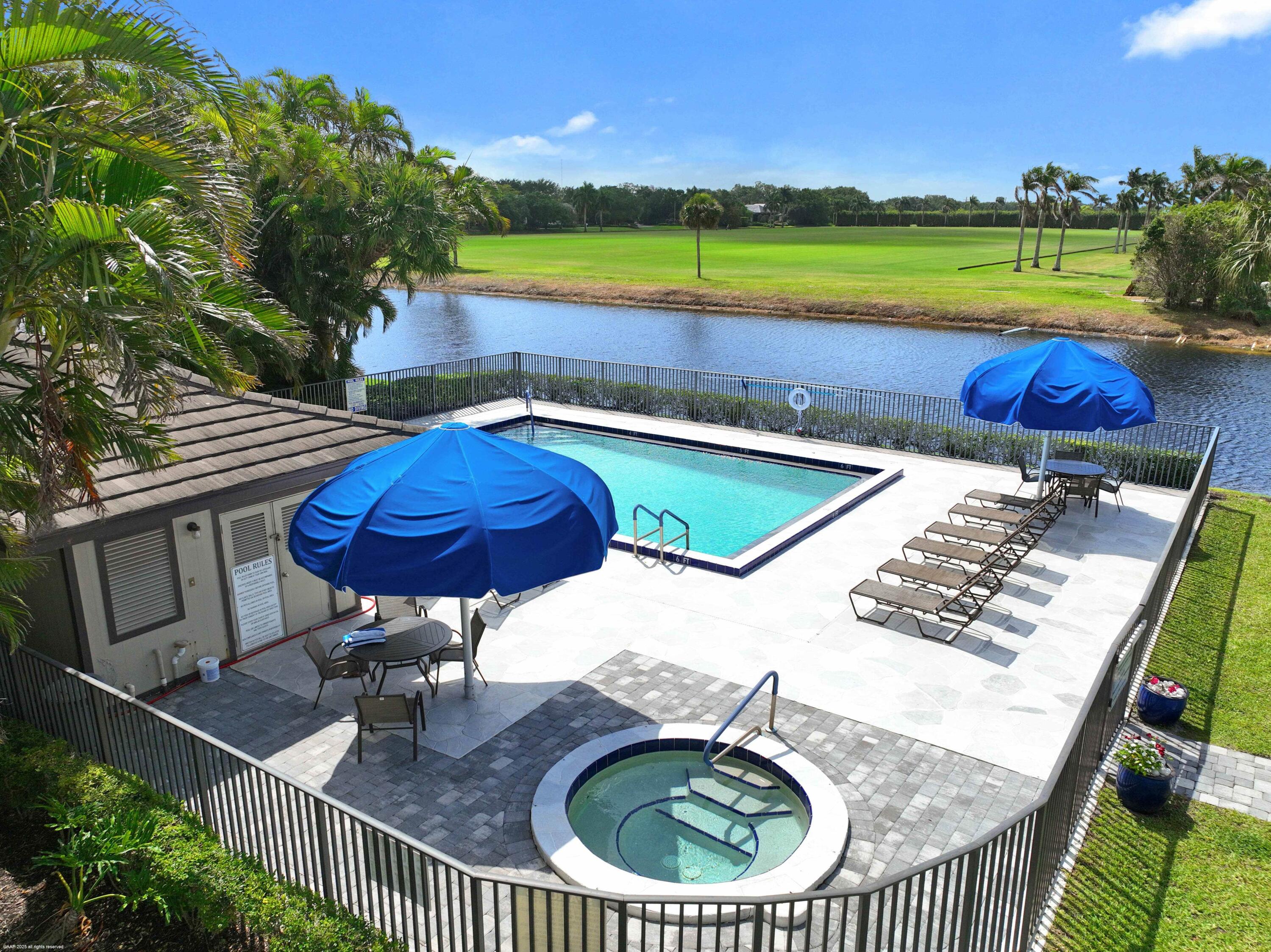 13254 Polo Club Road, Unit C101 Wellington, FL 33414 - Photo 57 of 71 swimming pool view with a seating space