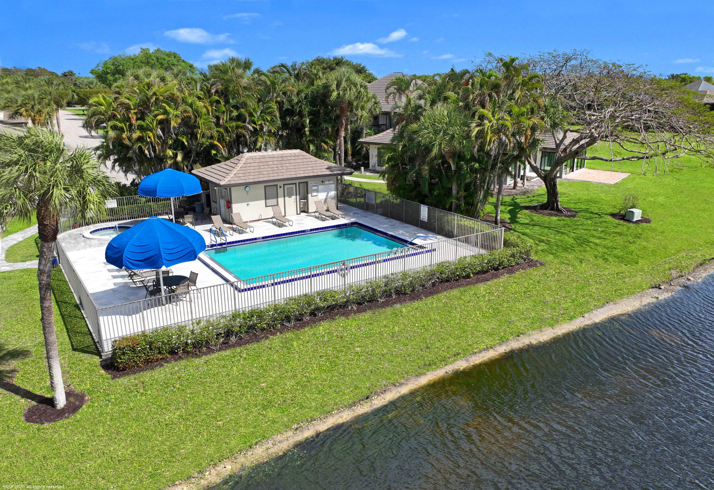 13254 Polo Club Road, Unit C101 Wellington, FL 33414 - Photo 58 of 71 a view of a backyard with a slide