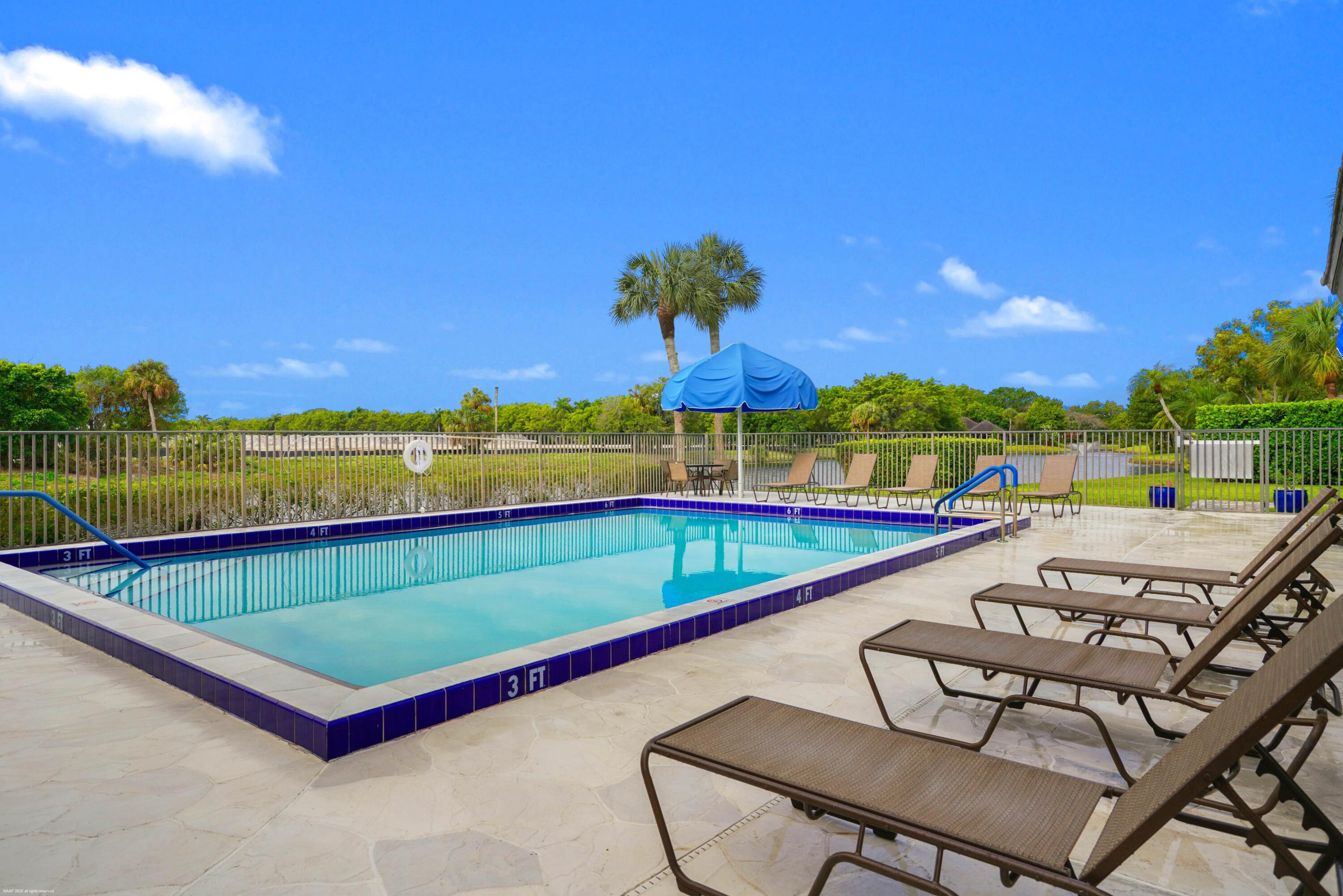 13254 Polo Club Road, Unit C101 Wellington, FL 33414 - Photo 60 of 71 a view of swimming pool with seating area and furniture