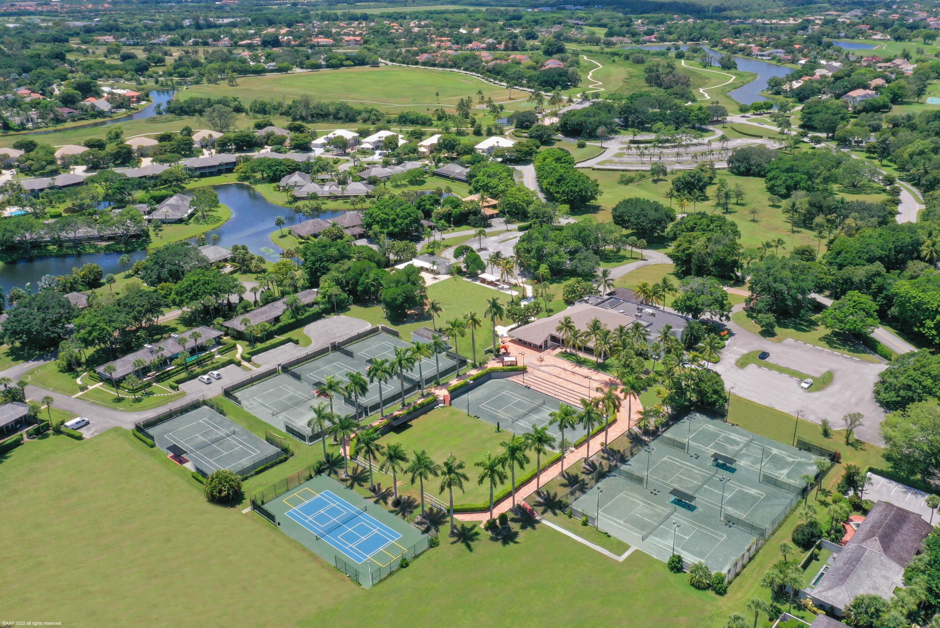 13254 Polo Club Road, Unit C101 Wellington, FL 33414 - Photo 64 of 71 an aerial view of residential houses with outdoor space and pool