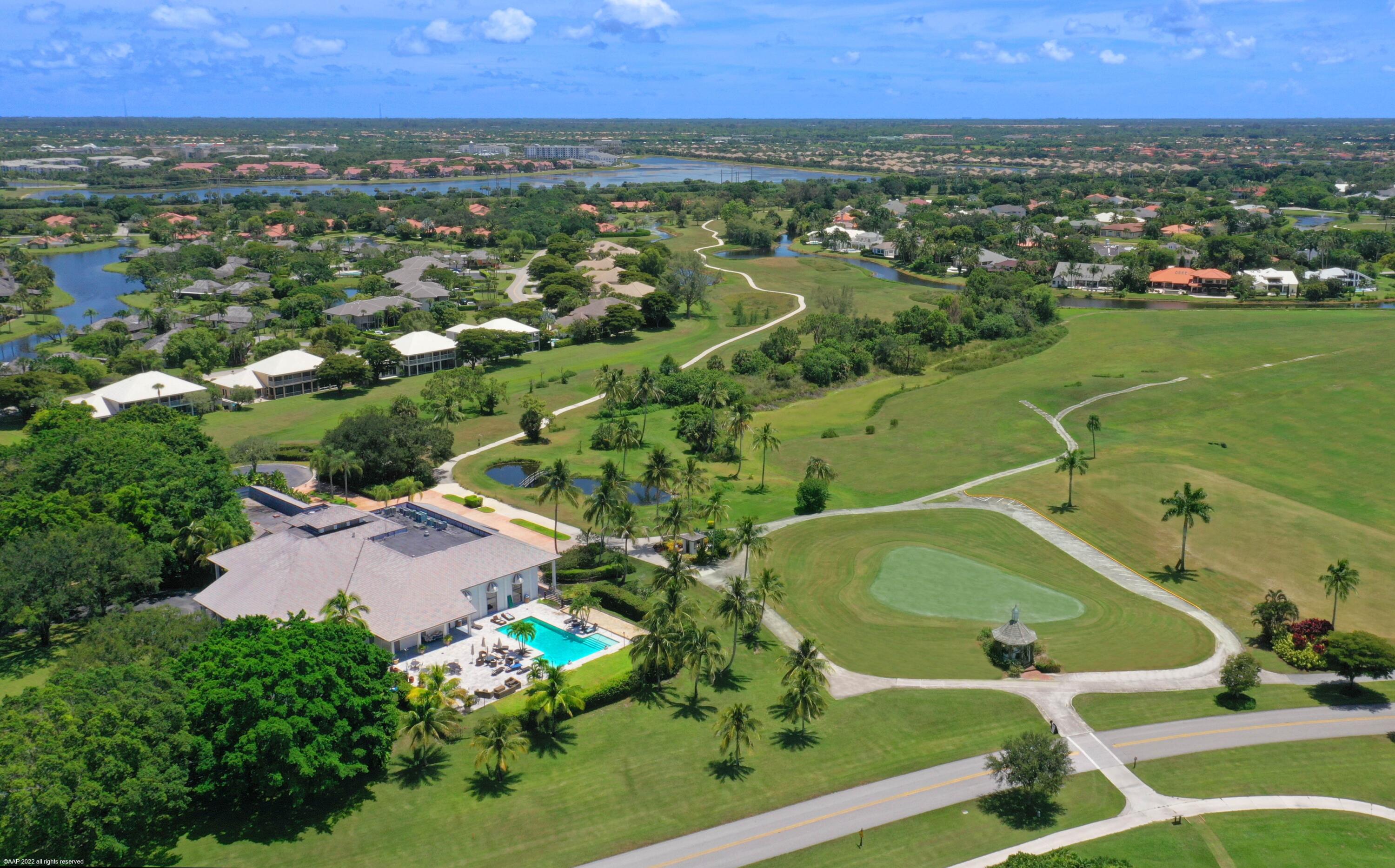 13254 Polo Club Road, Unit C101 Wellington, FL 33414 - Photo 65 of 71 an aerial view of residential houses with outdoor space and trees