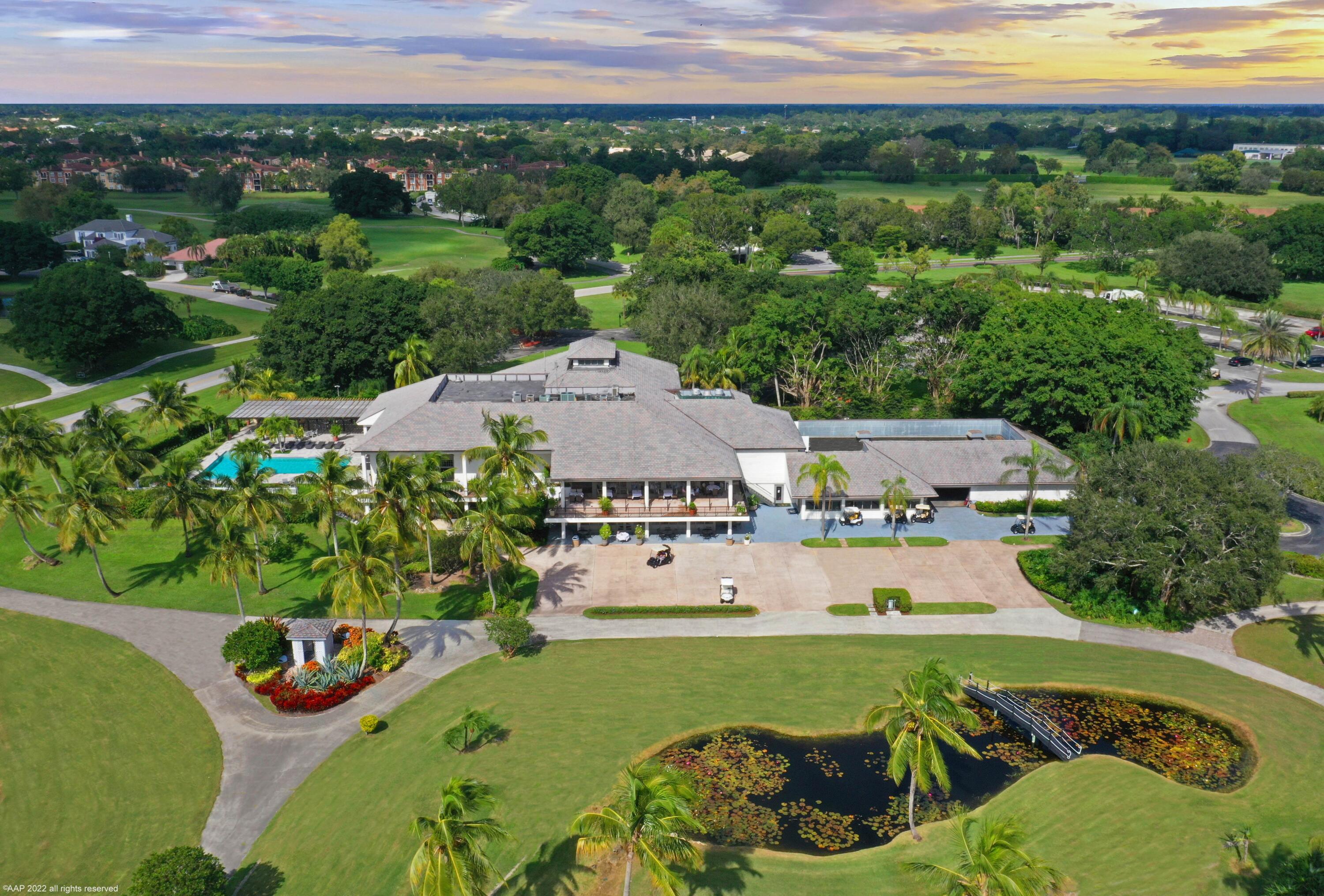 13254 Polo Club Road, Unit C101 Wellington, FL 33414 - Photo 66 of 71 an aerial view of a house with garden space and lake view