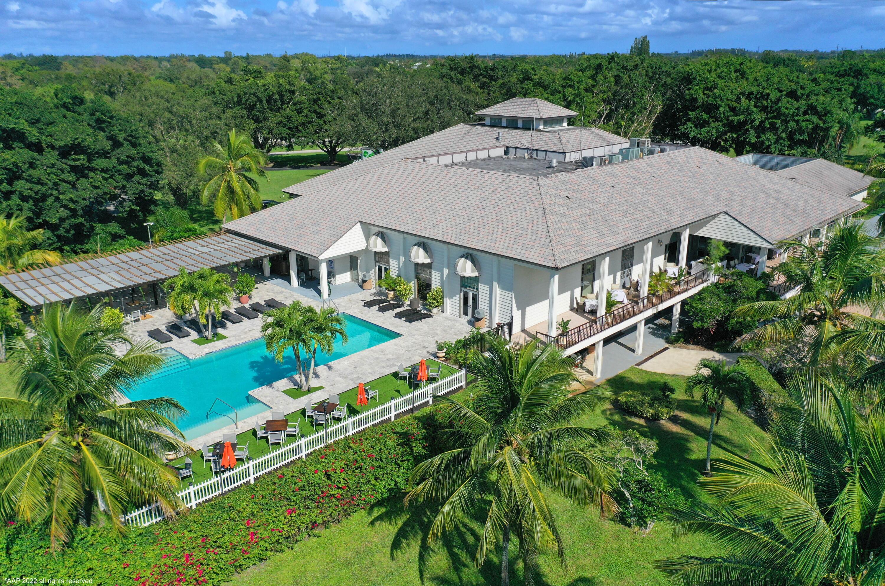 13254 Polo Club Road, Unit C101 Wellington, FL 33414 - Photo 67 of 71 an aerial view of a house with yard and outdoor seating