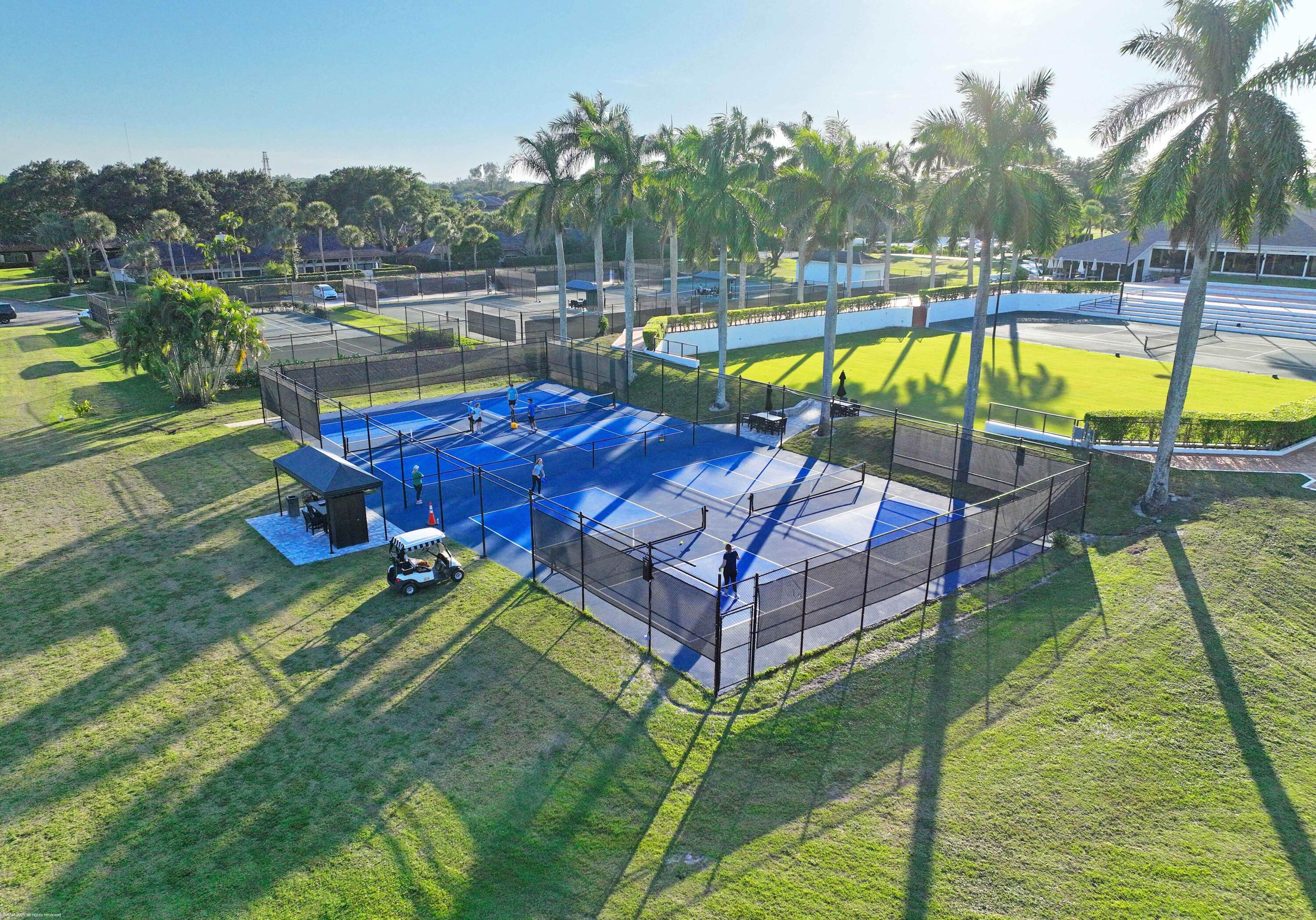 13254 Polo Club Road, Unit C101 Wellington, FL 33414 - Photo 70 of 71 a view of a swimming pool with a patio and a yard
