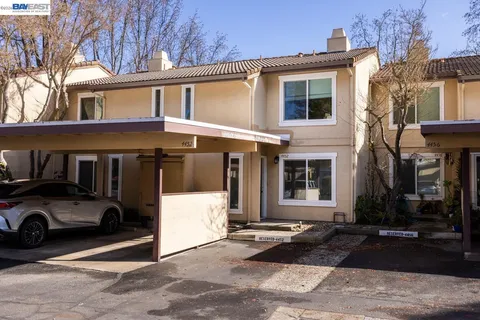 a view of a car park in front of house