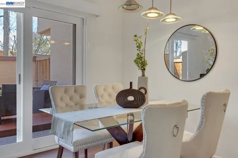 a view of a livingroom with furniture and mirror