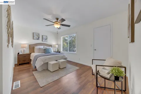 a bedroom with a bed and window