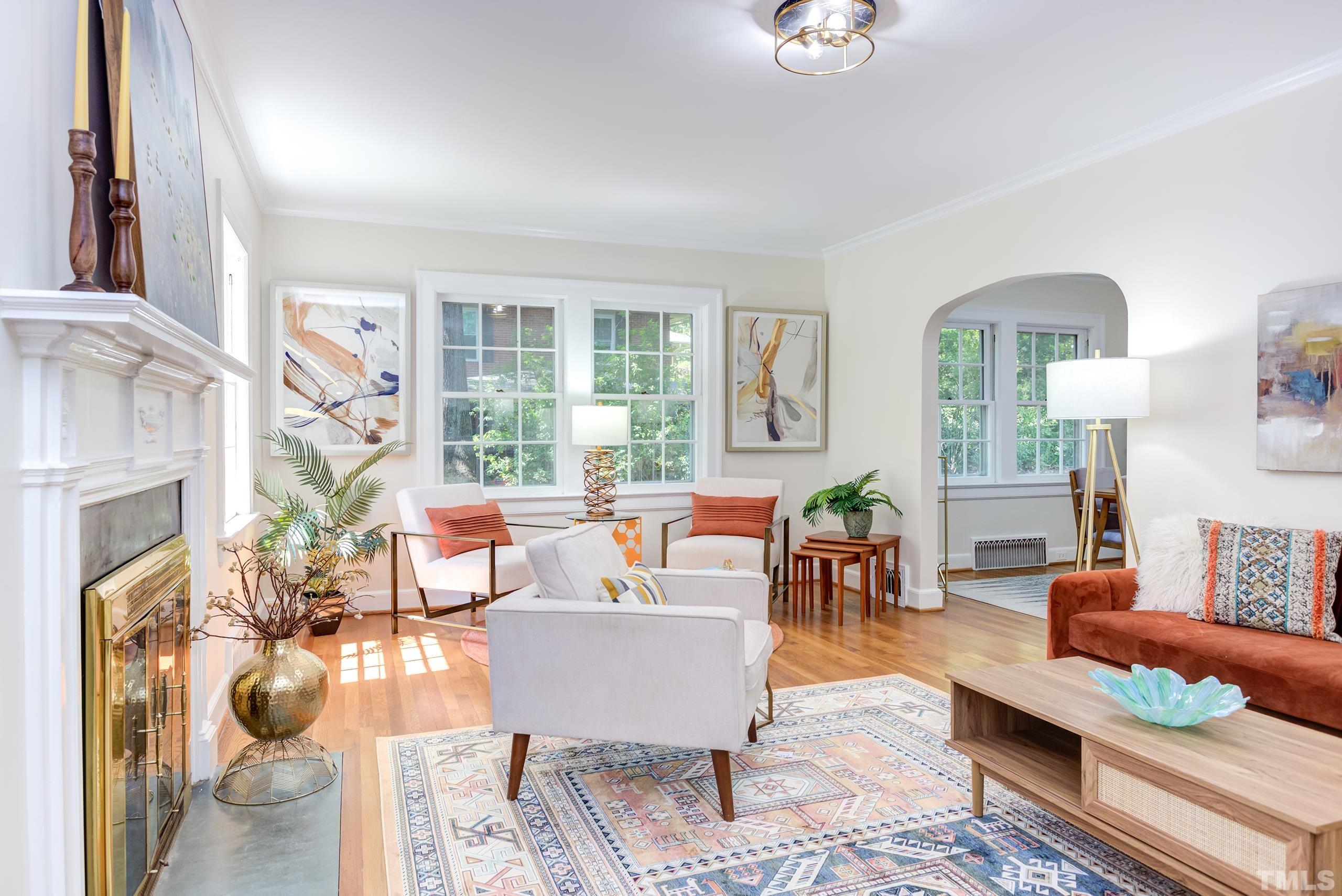 a living room with furniture and a fireplace
