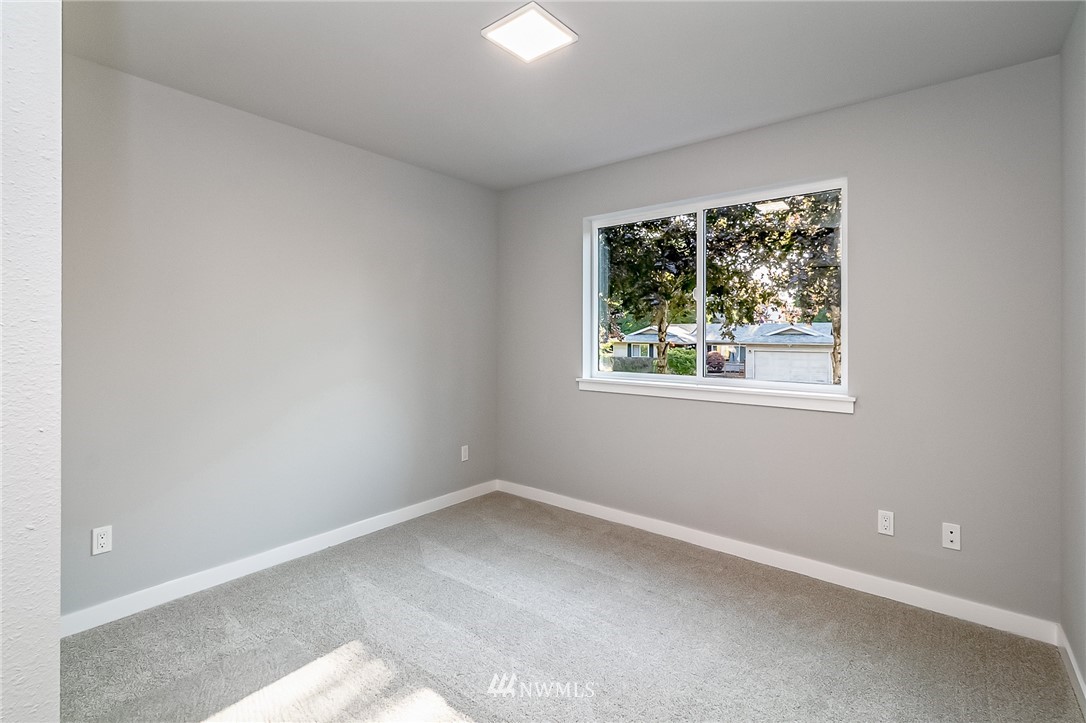 17702 30th Drive Southeast Bothell, WA 98012 - Photo 12 of 17 an empty room with a window