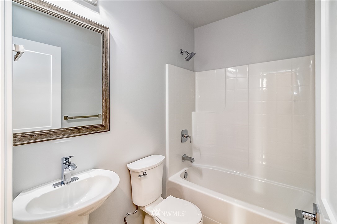 17702 30th Drive Southeast Bothell, WA 98012 - Photo 13 of 17 a bathroom with a sink toilet and shower