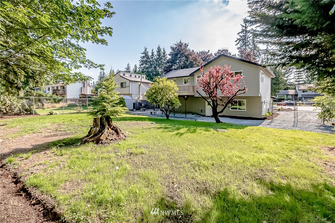 17702 30th Drive Southeast Bothell, WA 98012 - Photo 17 of 17 a view of swimming pool with a bench and trees in the background