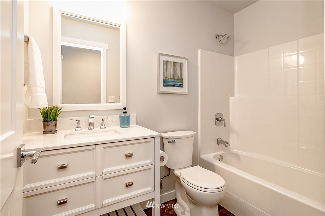 17702 30th Drive Southeast Bothell, WA 98012 - Photo 8 of 17 a bathroom with a sink a toilet and a bathtub