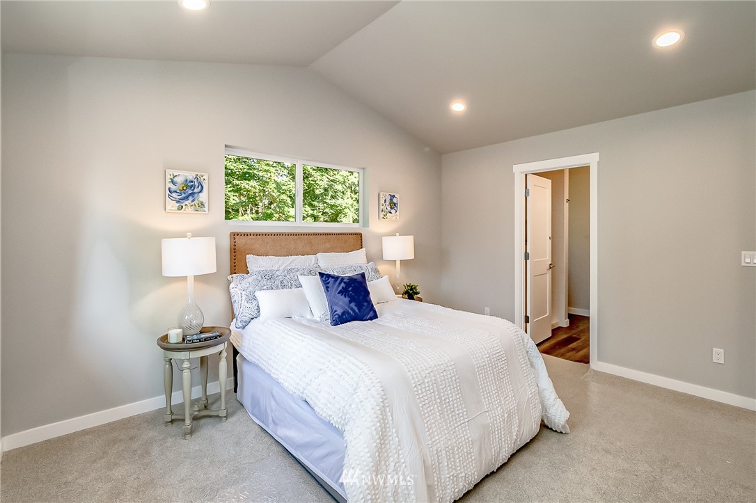 17702 30th Drive Southeast Bothell, WA 98012 - Photo 9 of 17 a bedroom with a bed and a window