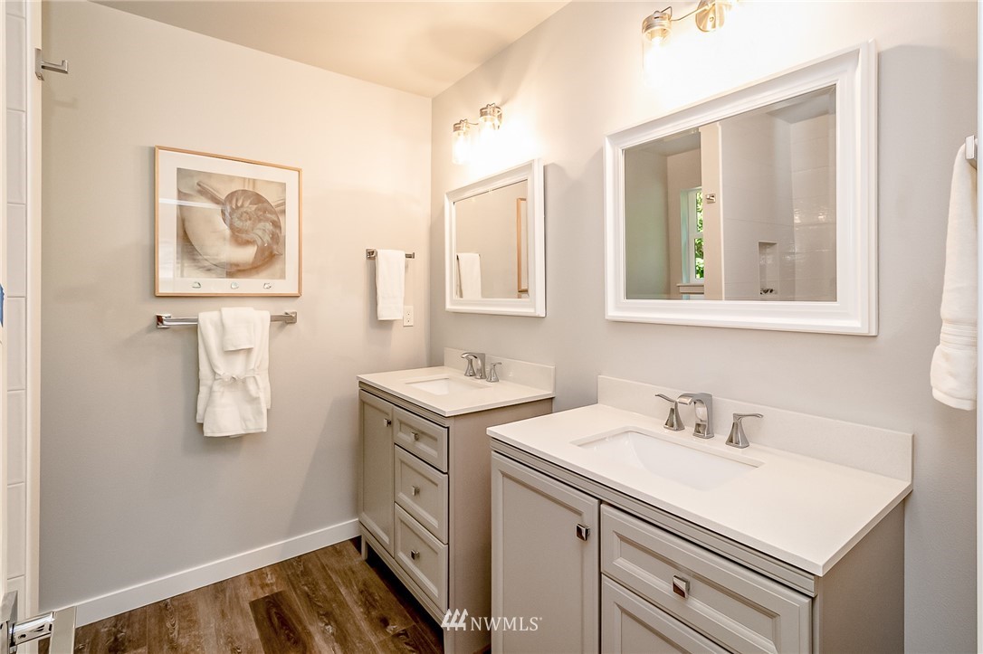 17702 30th Drive Southeast Bothell, WA 98012 - Photo 10 of 17 a bathroom with a sink and a mirror