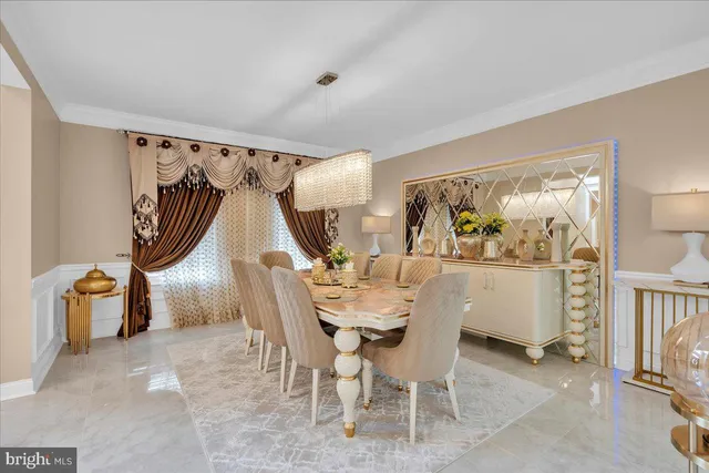 a dining room with furniture and a window